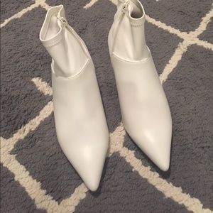 White leather pointy toe bootie.